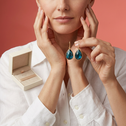 Ocean Muse Blue Teardrop Drop Earrings — Adult model holding product
